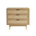Commode en bois clair avec trois tiroirs et panneau en rotin